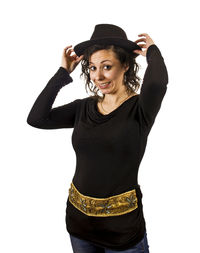 Portrait of young woman standing against white background