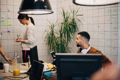 Young multi-ethnic computer programmers working at creative office