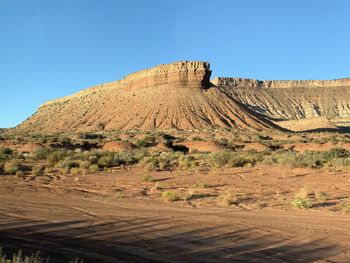 Rock formations in desert against sky