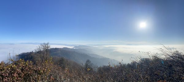 Scenic view of land against blue sky