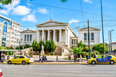 View of cars parked in city