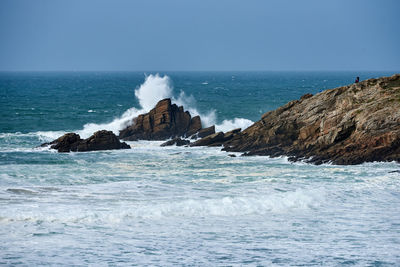 Waves of the atlantic ocean break on a rock with splashing gout  on quiberon in brittany in france 