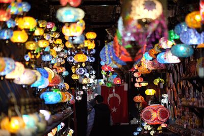 Colorful illuminated lanterns for sale in store