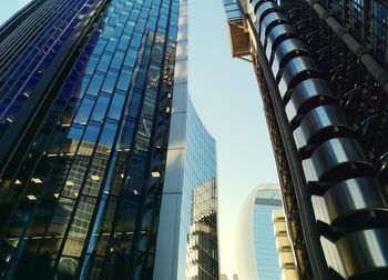 Low angle view of modern buildings against clear sky