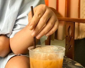 Close-up of person hand with ice cream