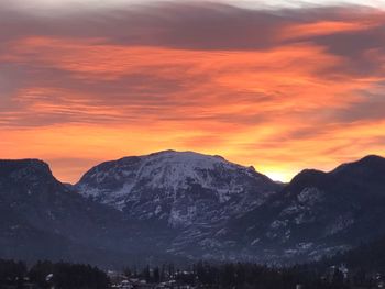 Scenic view of mountains against sky at sunset