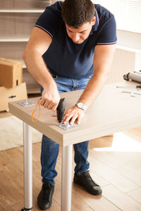 Low section of man working in workshop