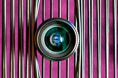 Close-up of camera against blinds