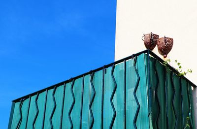Low angle view of horse against clear blue sky