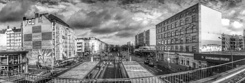 Buildings against cloudy sky