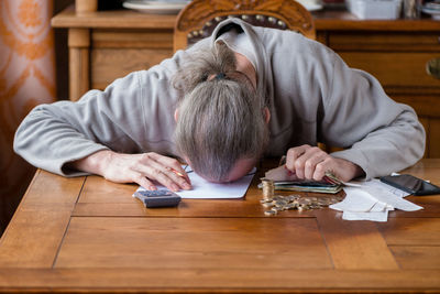 Portrait of man sitting on table