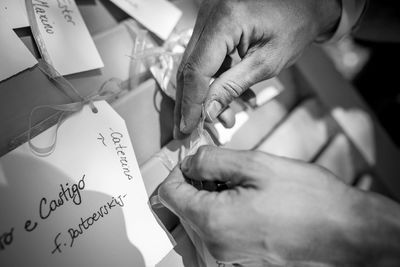 Close-up of hand holding paper