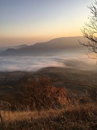 Scenic view of landscape against sky during sunset