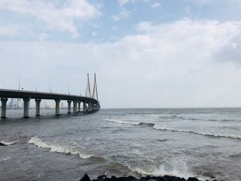 View of bridge over sea against sky