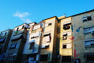 Low angle view of building against blue sky