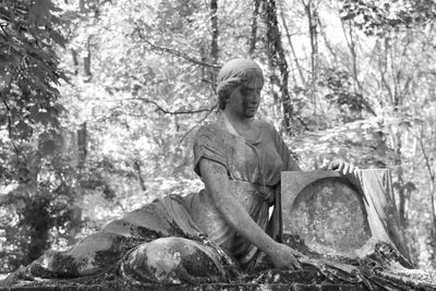 Statue of man in cemetery