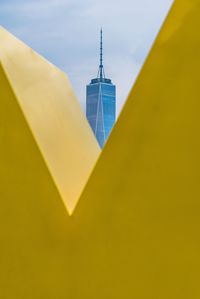 Yellow umbrella against sky