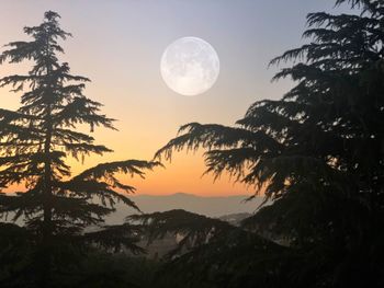 Scenic view of silhouette mountains against sky at sunset