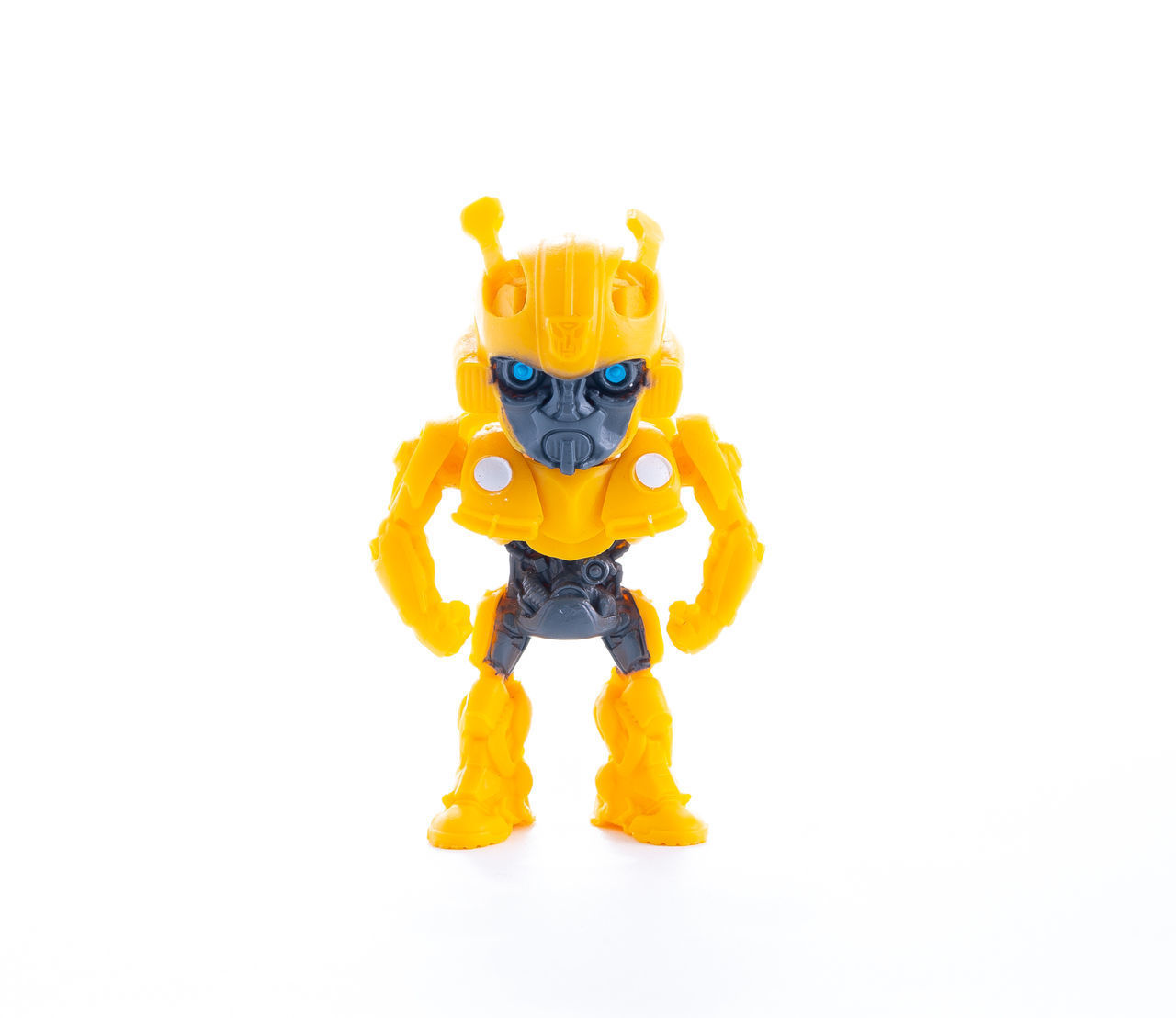 CLOSE-UP OF YELLOW TOY ON WHITE BACKGROUND