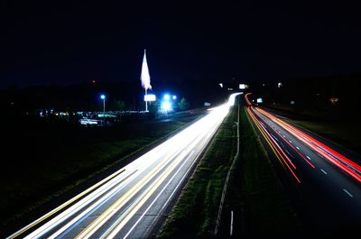 High angle view of light trails on road at night