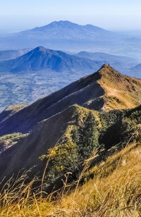 Aerial view of landscape against cloudy sky