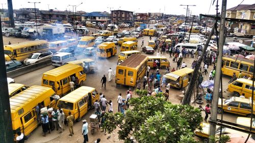 High angle view of people and buses at iyana ipaja bus stop