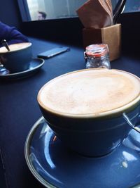 Close-up of coffee cup on table