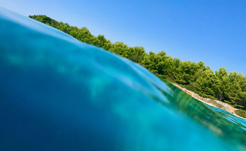 Scenic view of swimming pool against clear blue sky