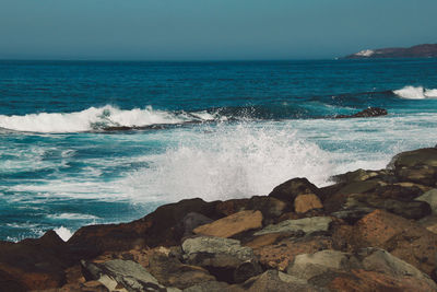 Scenic view of sea against clear sky