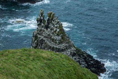 High angle view of rocks in sea