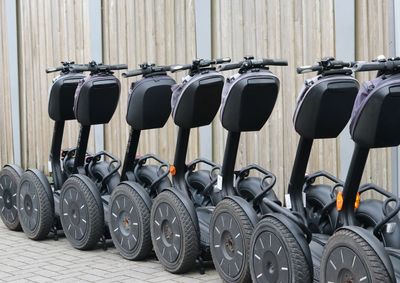 Segways parked on sidewalk