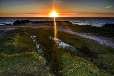 Scenic view of sea against sky during sunset