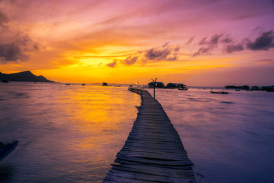 Scenic view of sea against orange sky