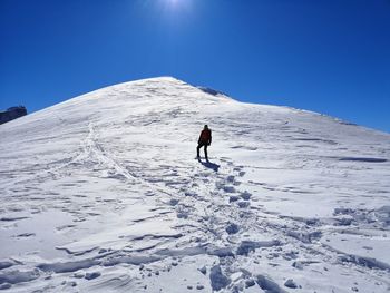 Climbing on a snowcapped mountain