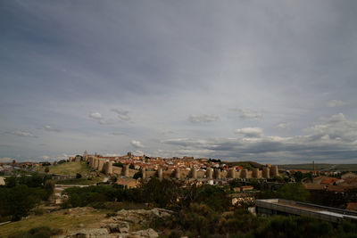 Townscape against cloudy sky