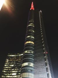 Low angle view of skyscrapers lit up at night