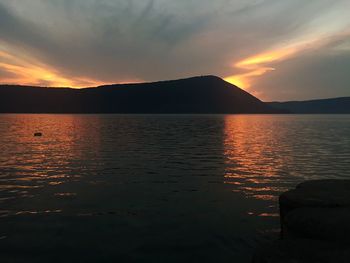 Scenic view of lake at sunset