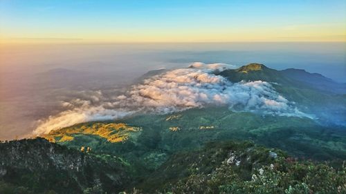 High angle view of land against sky during sunset