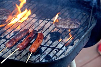 Close-up of preparing food on barbecue grill