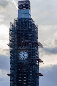 Low angle view of clock tower against sky