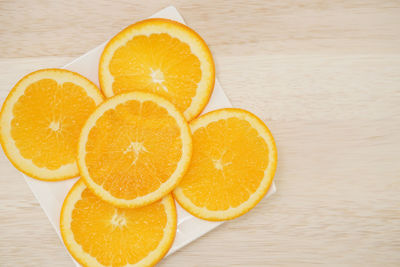 Close-up of oranges on table