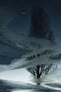 Frozen landscape against sky