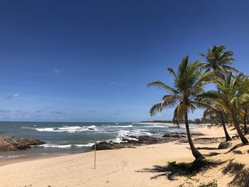 Scenic view of sea against clear blue sky