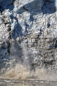 Scenic view of frozen water on land