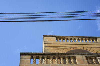 Low angle view of building against blue sky