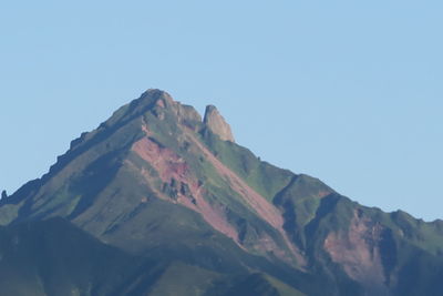 Low angle view of mountains against clear sky