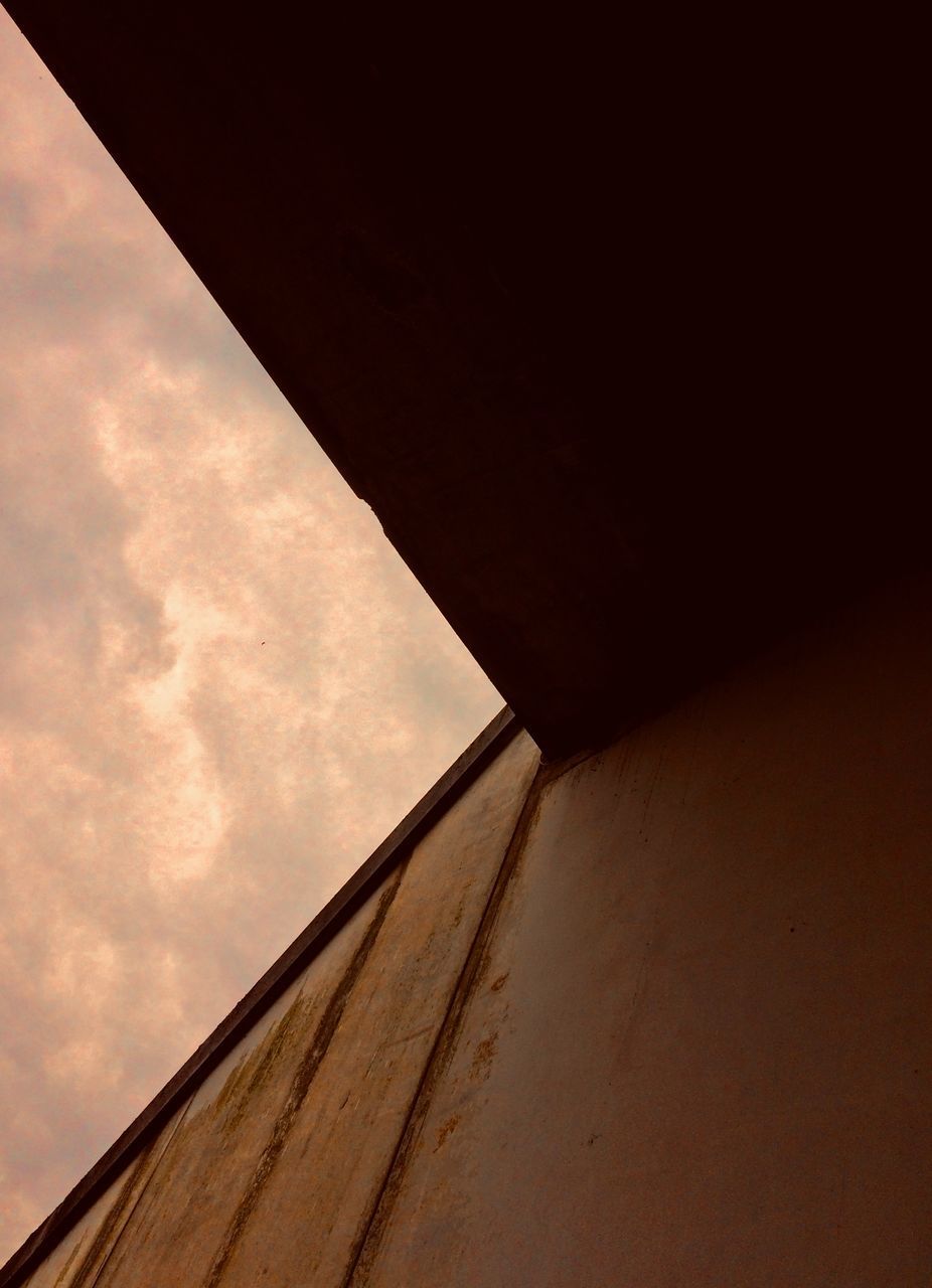 LOW ANGLE VIEW OF WALL AGAINST SKY