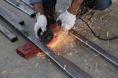 High angle view of man working on metal