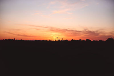 Silhouette landscape against sky during sunset