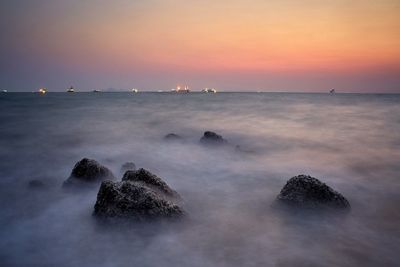 Scenic view of sea against sky during sunset